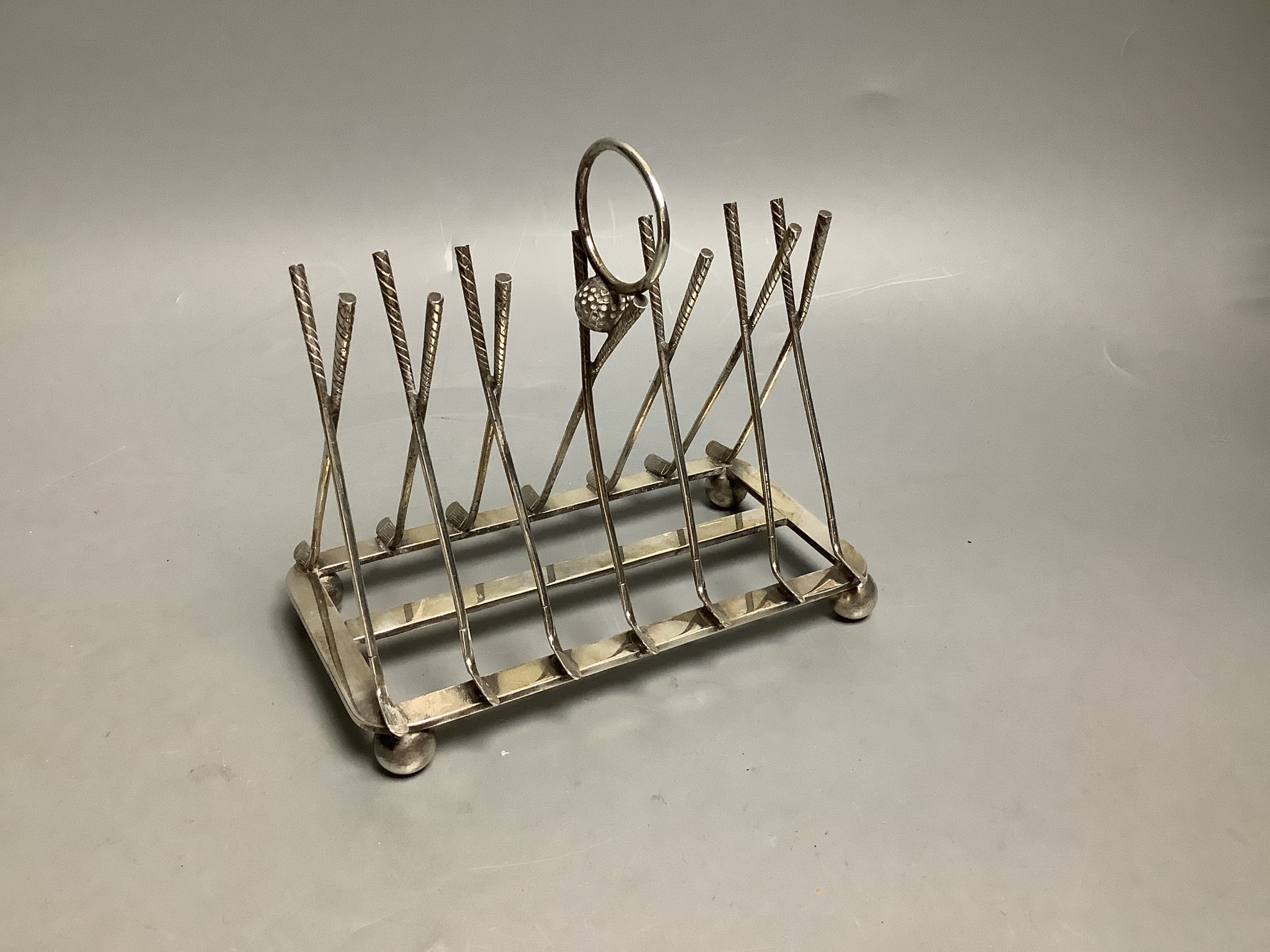 A novelty golfing silver plated toast rack